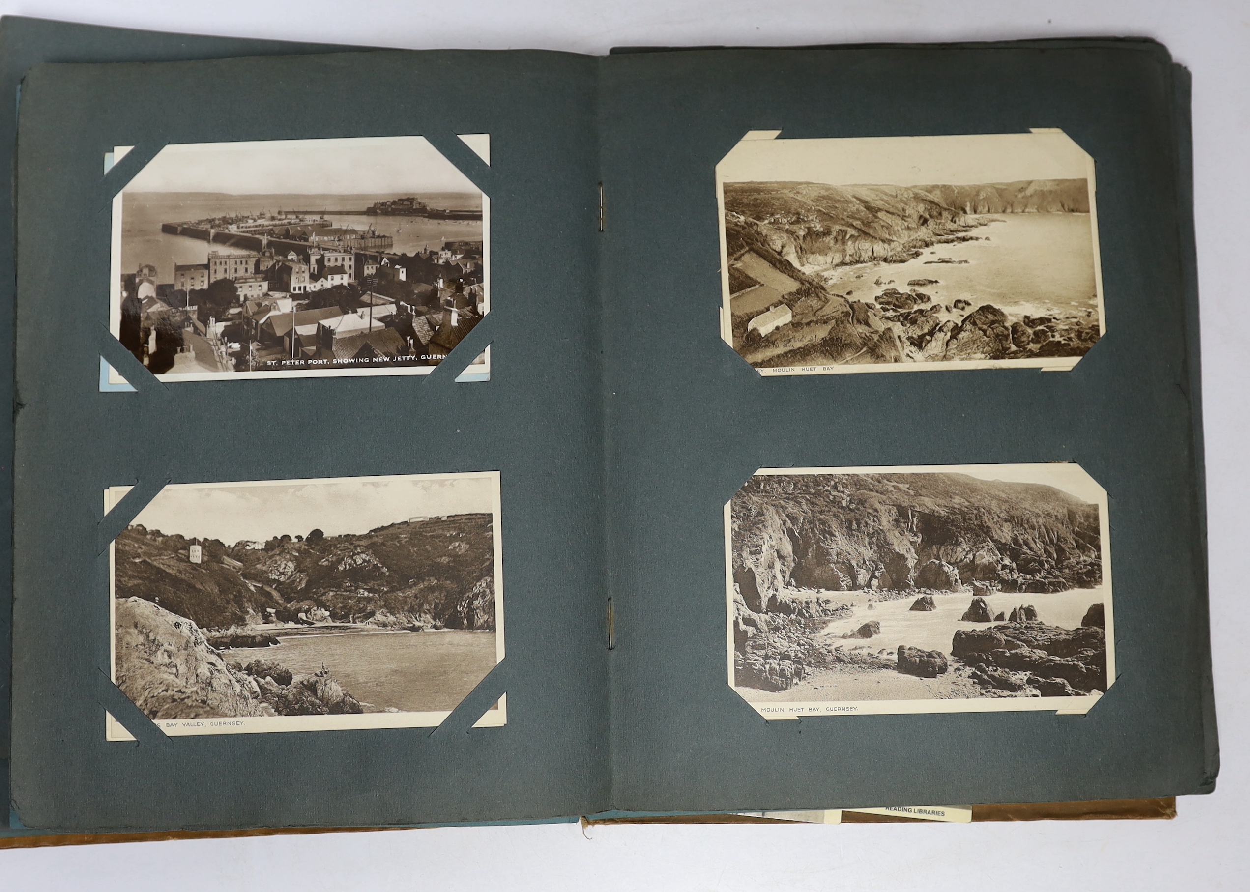 A postcard album and various early 20th century postcards, of various views of UK towns, etc.